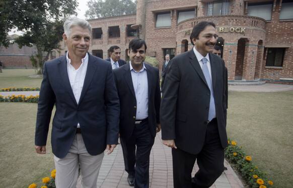 Chief Executive of the International Cricket Council (ICC), David Richardson, left, and Pakistan Cricket Board chairman Zaka Ashraf, right, walk following a media conference in Lahore, Pakistan.