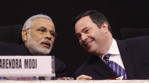 Gujarat state chief minister Narendra Modi speaks with Canadian Minister of Citizenship, Immigration and Multiculturalism, Jason Kenney, during the 6th Vibrant Gujarat Global Summit (VGGS) in Gandhinagar.