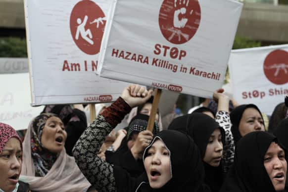 Pakistani Shiite Muslim women, chant slogans during a protest to condemn Thursday`s deadly bombings in Quetta, in Karachi.