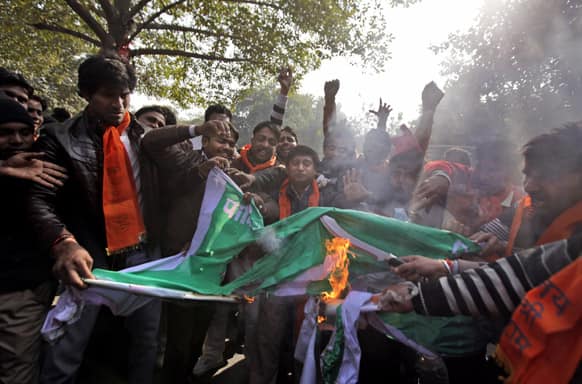 Activists of the right wing Hindu nationalist Bajrang Dal set fire to a Pakistani flag during a protest in New Delhi.