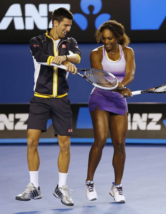 Serbia`s Novak Djokovic and Serena Williams of the US perform the gangnam style dance during the Kids Tennis Day at Melbourne Park ahead of the Australian Open tennis championship in Melbourne, Australia.