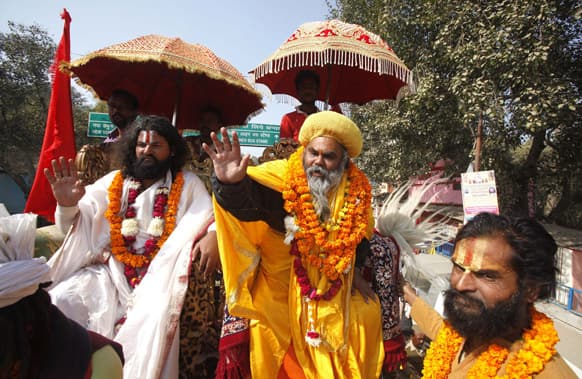 Sadhus, or Hindu holy men, arrive in a religious procession to participate in the Maha Kumbh Mela at the Sangam, the confluence of rivers Ganges, Yamuna and mythical Saraswati, in Allahabad.