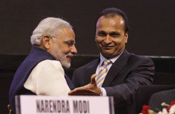 Chairman of Anil Dhirubhai Ambani Group Anil Ambani, right, gestures towards Gujarat state Chief Minister Narendra Modi during the inauguration of the 6th Vibrant Gujarat Global Summit (VGGS) in Gandhinagar.