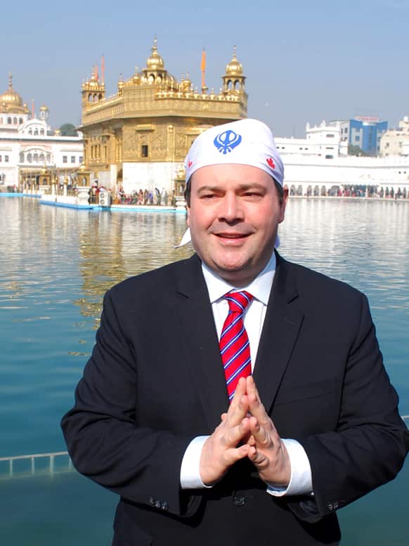 Canada`s Minister of Citizenship, Immigration and Multiculturalism Jason Kenney poses for a photograph during his visit to the Golden temple, Sikh’s holiest temple, in Amritsar.