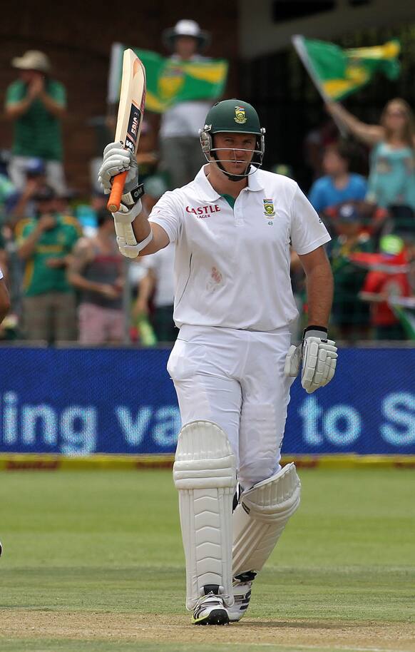 South Africa`s captain Graeme Smith waves bat to celebrate his half century on the day one of their second cricket test match against New Zealand at the St Georges Stadium in Port Elizabeth, South Africa.