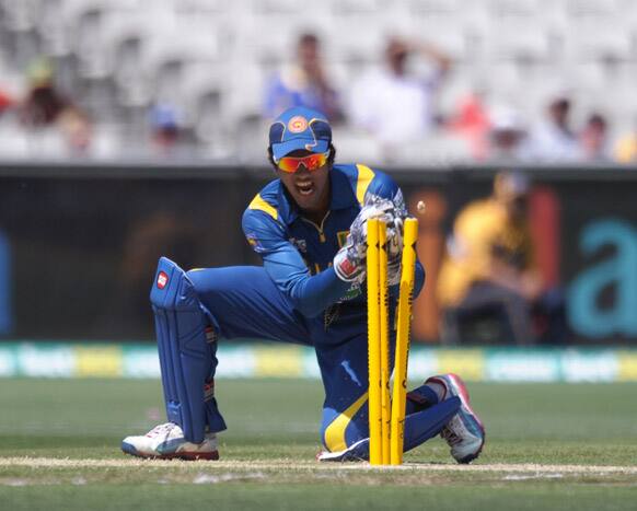 Sri Lanka`s Dinesh Chandimal runs out Australia`s Usman Kawaja during their One Day International cricket match at the Melbourne Cricket Ground.