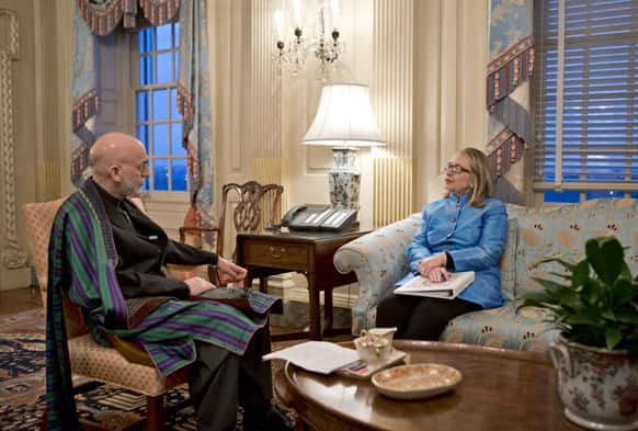 Secretary of State Hillary Rodham Clinton meets with Afghanistan President Hamid Karzai, left, at the State Department in Washington.