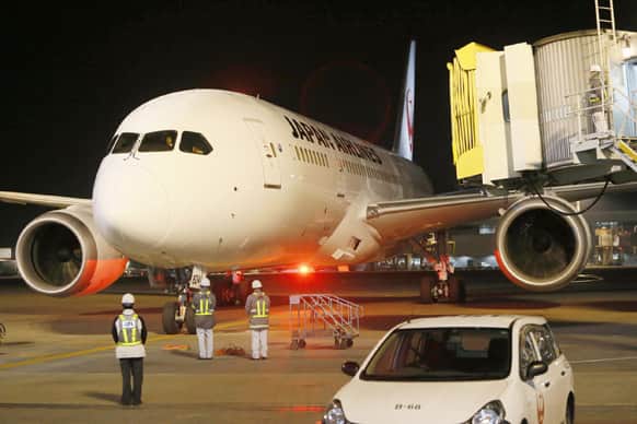A Japan Airlines 787, from which about 40 gallons of fuel spilled at Boston`s Logan International Airport Tuesday, arrives at Narita Airport.