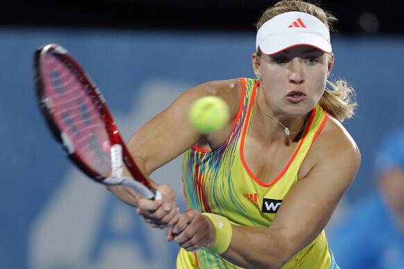Germany`s Angelique Kerber returns a shot to Russia`s Svetlana Kuznetsova at the Sydney International tennis tournament.