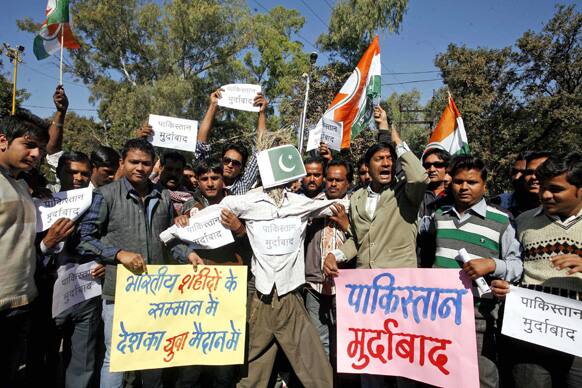 Congress party activists shout slogans before burning an effigy representing Pakistan during a protest in Bhopal.