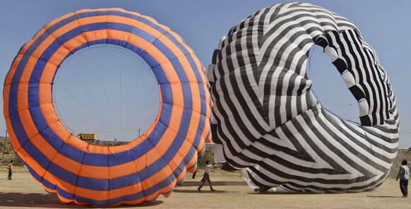 Indians prepare to fly giant kites in Ahmadabad, India, Wednesday, Jan. 9, 2013. Makar Sankranti, the festival of kites that marks the transition of winter to spring, will be celebrated on Jan. 14.