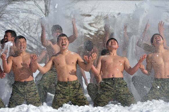 Members of the South Korean Special Warfare Forces hurl snow while shouting during a winter exercise in Pyeongchang, South Korea. About 200 soldiers participated in the 12 day winter exercise.