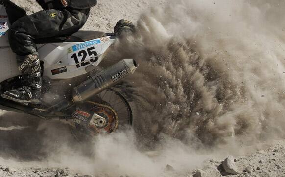 KTM Ferdinand Kreidl of Austria kicks up dust on a way up a mountain during the 4nd stage of the 2013 Dakar Rally from Nazca to Arequipa, Peru.