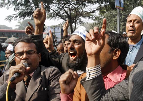 Bangladeshi non-government teachers shout slogans during a demonstration in Dhaka, Bangladesh.
