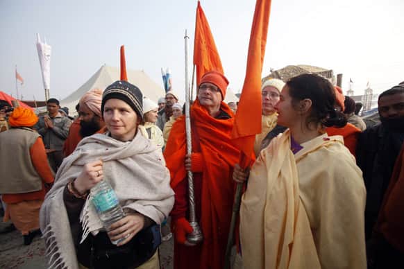 Foreign Hindu devotees arrive for a religious procession towards the Sangam, the confluence of rivers Ganges, Yamuna and mythical Saraswati, as part of the Mahakumbh festival in Allahabad.