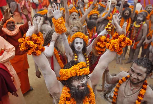 Naga Sadhus, or Naked Hindu holy men, arrive during a religious procession towards the Sangam, the confluence of rivers Ganges, Yamuna and mythical Saraswati, as part of the Mahakumbh festival in Allahabad.