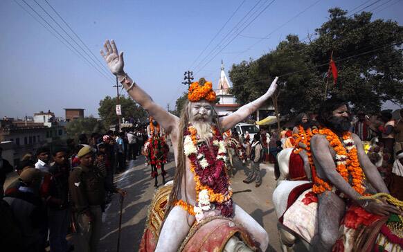 Naga Sadhus, or Naked Hindu holy men, participate in a religious procession towards the Sangam, the confluence of rivers Ganges, Yamuna and mythical Saraswati, as part of the Mahakumbh festival in Allahabad.