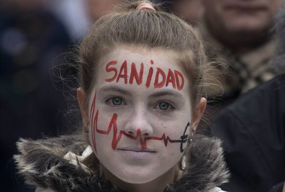 A demonstrator takes part in a National health workers march during the first major demonstration of the year, in Madrid.