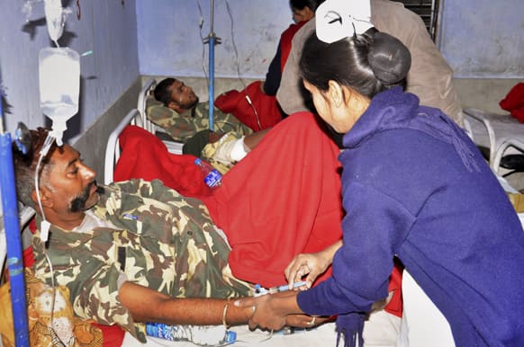 Central Reserve Police Force (CRPF) soldiers, in uniform, are treated at a hospital in Daltangunj, Jharkhand.