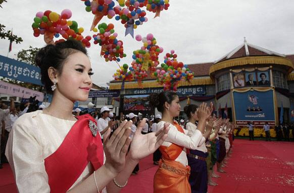 Cambodian dancers perform at Prime Minister Hun Sen`s ruling Cambodian People`s Party headquarters during the 34th celebration marking the 1979 downfall of the Khmer Rouge regime, in Phnom Penh.