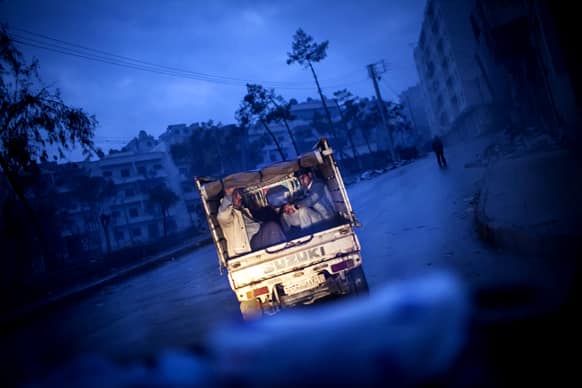 Syrian men leave the old city of Aleppo, Syria. The revolution against Syrian President Bashar Assad that began in March 2011, started with peaceful protests but morphed into a civil war that has killed more than 60,000 people, according to a recent United Nations recent estimate.
