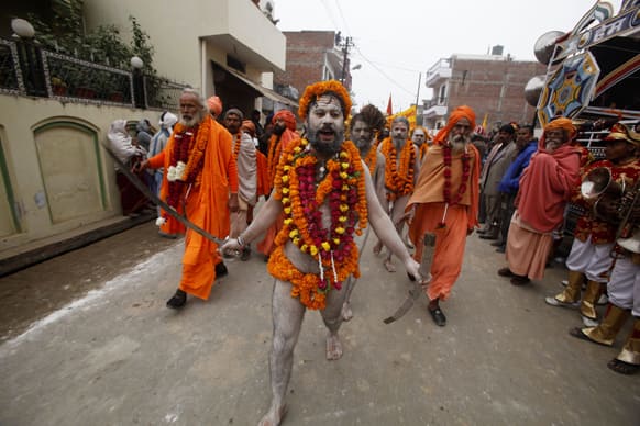 Naga Sadhus, or naked Hindu holy men of the Anand Akhada group, participate in a religious procession towards the Sangam, the confluence of rivers Ganges, Yamuna and mythical Saraswati, as part of the Mahakumbh festival in Allahabad.
