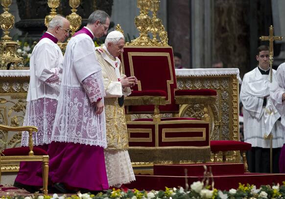 Pope Benedict XVI, third left, arrives to celebrate an Epiphany Mass in St.Peter`s Basilica at the Vatican.