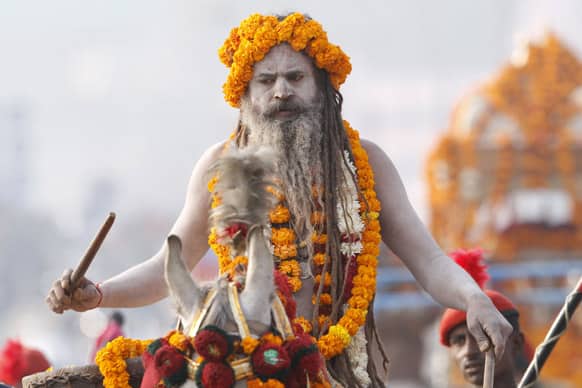 A Naga Sadhus participate in a religious procession towards the Sangam, the confluence of rivers Ganges, Yamuna and mythical Saraswati, as part of the Mahakumbh festival in Allahabad.