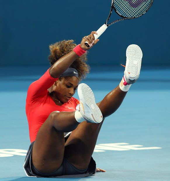 Serena Williams of the United States takes a tumble in the women`s final match against Anastasia Pavlyuchenkova of Russia during the Brisbane International tennis tournament in Australia.