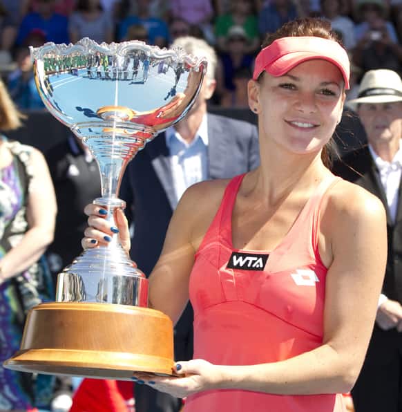 Poland`s Agniezska Radwanska holds the trophy after defeating Belgium`s Yanina Wickmayer in the final of the singles at the ASB Classic women`s tennis tournament in Auckland, New Zealand.