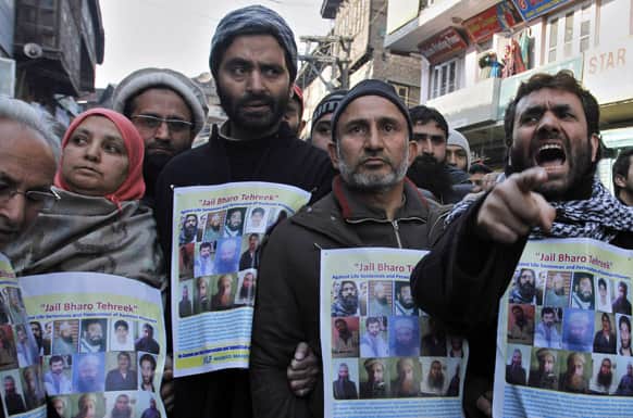 Jammu Kashmir Liberation Front (JKLF) Chairman Yasin Malik, joins supporters during a protest in Srinagar.