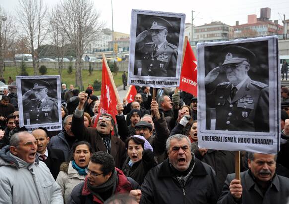 Turks wave national flags and his posters as Ismail Hakki Karadayi, Turkey`s former Chief of Staff, arrives at a courthouse in Ankara, Turkey.
