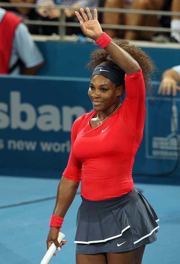 Serena Williams of the U.S. waves at the crowd after winning her quarter final match against Sloane Stephens of the U.S. 6-4, 6-3 during the Brisbane International tennis tournament in Brisbane, Australia.
