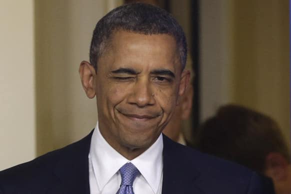 President Barack Obama winks as he arrives to make a statement regarding the passage of the fiscal cliff bill in the Brady Press Briefing Room at the White House in Washington.