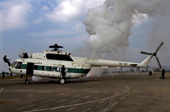 Palestinian members of Hamas` special security unit demonstrate freeing hostages from a hijacked helicopter during a graduation ceremony in Gaza City.