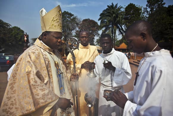 The priest and his assistants prepare to conduct a New Year`s Day morning mass at the Notre Dame Cathedral of the Immaculate Conception in Bangui, Central African Republic.