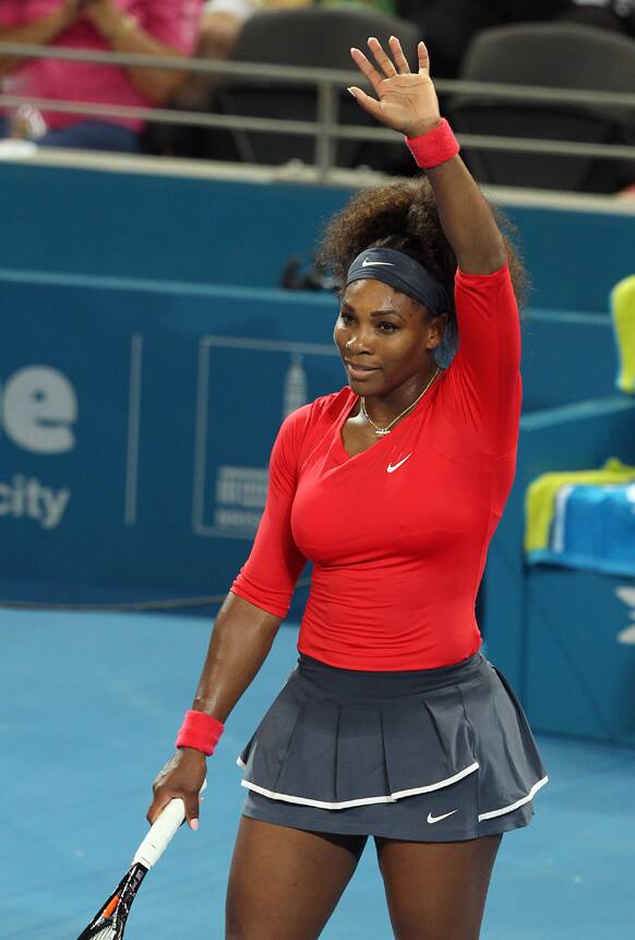 Serena Williams of the U.S. waves at the crowd after she beat Alize Cornet of France 6-2, 6-2 during the Brisbane International tennis tournament in Brisbane, Australia.