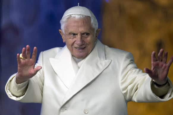 Pope Benedict XVI waves from his popemobile as he visits the Nativity St. Peter`s Square at the Vatican.