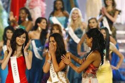 Miss Gibraltar Kaiane Aldorino (C) reacts after being named Miss World during the Miss World finals in Midrand, outside Johannesburg