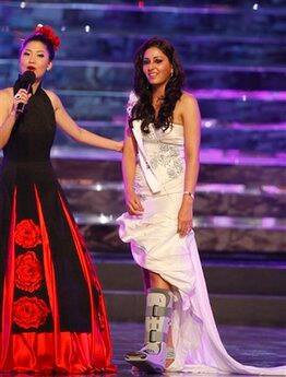 Miss India Pooja Chopra walks onto the stage during the Miss World pageant in Johannesburg, South Africa