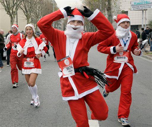 Runners, dressed as Santa Claus, take part in the 