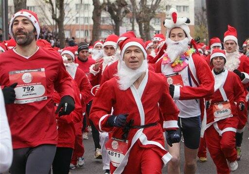 Runners, dressed as Santa Claus, take part in the 