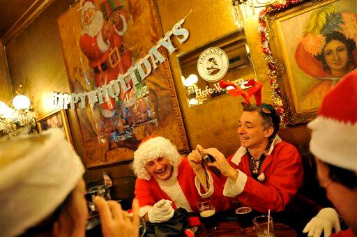 Santas fill the historic Gold Dust Lounge during the Santacon pub crawl in downtown San Francisco