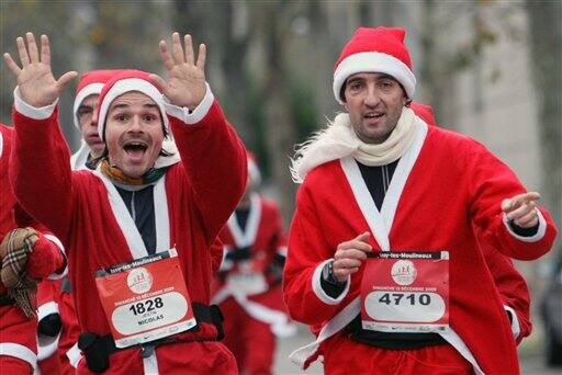 Runners, dressed as Santa Claus, take part in the 