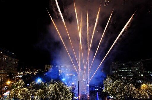 Fireworks soar into the sky in Athens' central Syntagma Square on Friday, Dec. 11, 2009, during the official inauguration of the Greek capital's Christmas celebrations. Police are on standby in the sq