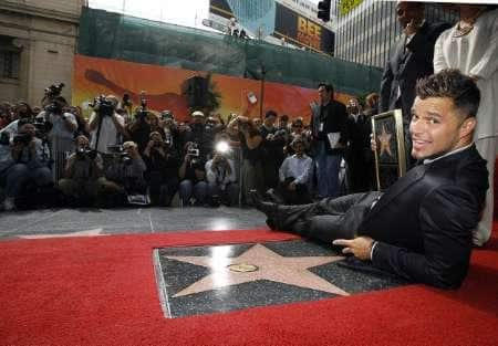 Puerto Rican singer Ricky Martin lays by his star on the Walk of Fame in Hollywood October 16, 2007. Martin is the 2,351st celebrity to be honored with a star on the Walk of Fame.