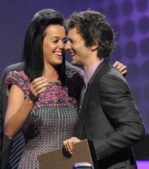 Katy Perry is seen on stage with Lukasz 'Dr Luke' Gottwald as he accepts the Songwriter of the Year award at the 27th Annual ASCAP Pop Music Awards in Los Angeles.