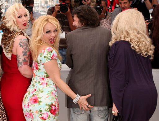 From left to right, actress Mimi Le Meaux, actress Julie Atlas Muiz, actor and director Mathieu Amalric, and actress Dirty Martini, attend a photo call for  Tournee, at the 63rd international film festival, in Cannes, southern France, Thursday, May 13, 2010.