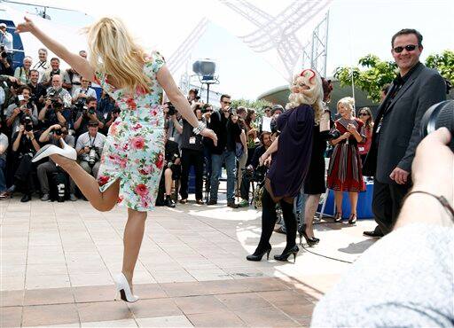 Actresses Julie Atlas Muiz, left, and Dirty Martini attend a photo call for Tournee , at the 63rd international film festival, in Cannes, southern France, Thursday, May 13, 2010.