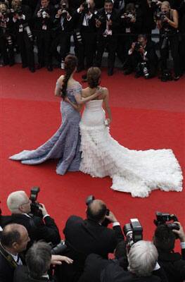 Actress Aishwarya Rai, left, and actress Eva Longoria, right, arrive on the red carpet for the premiere for the film Robin Hood, at the 63rd international film festival, in Cannes, southern France,